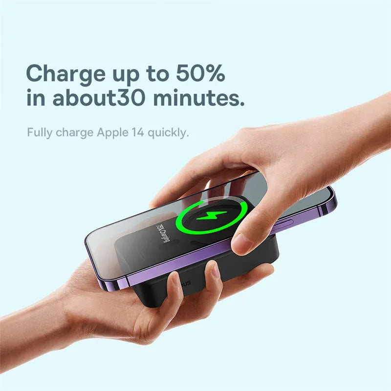 Person holding a phone with a wireless charging pad on a light blue background