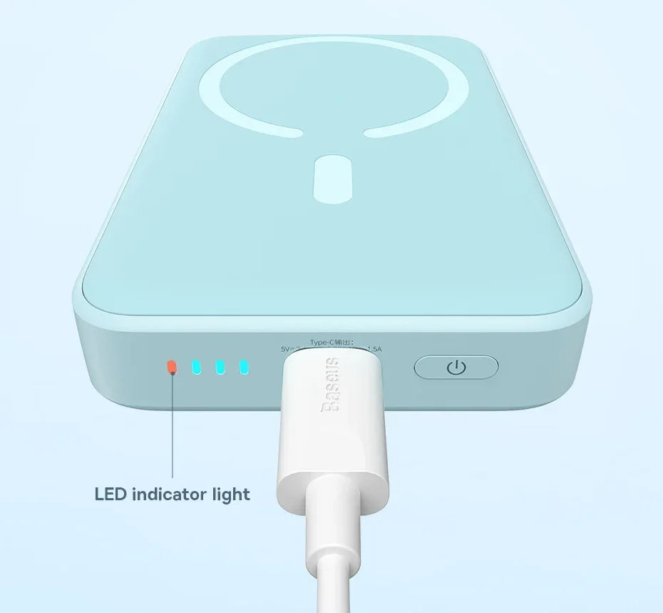 Light blue electronic device with LED indicator light on a white background