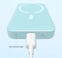 Light blue electronic device with LED indicator light on a white background