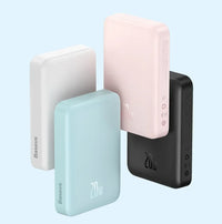 Four power banks in different colors on a light blue background